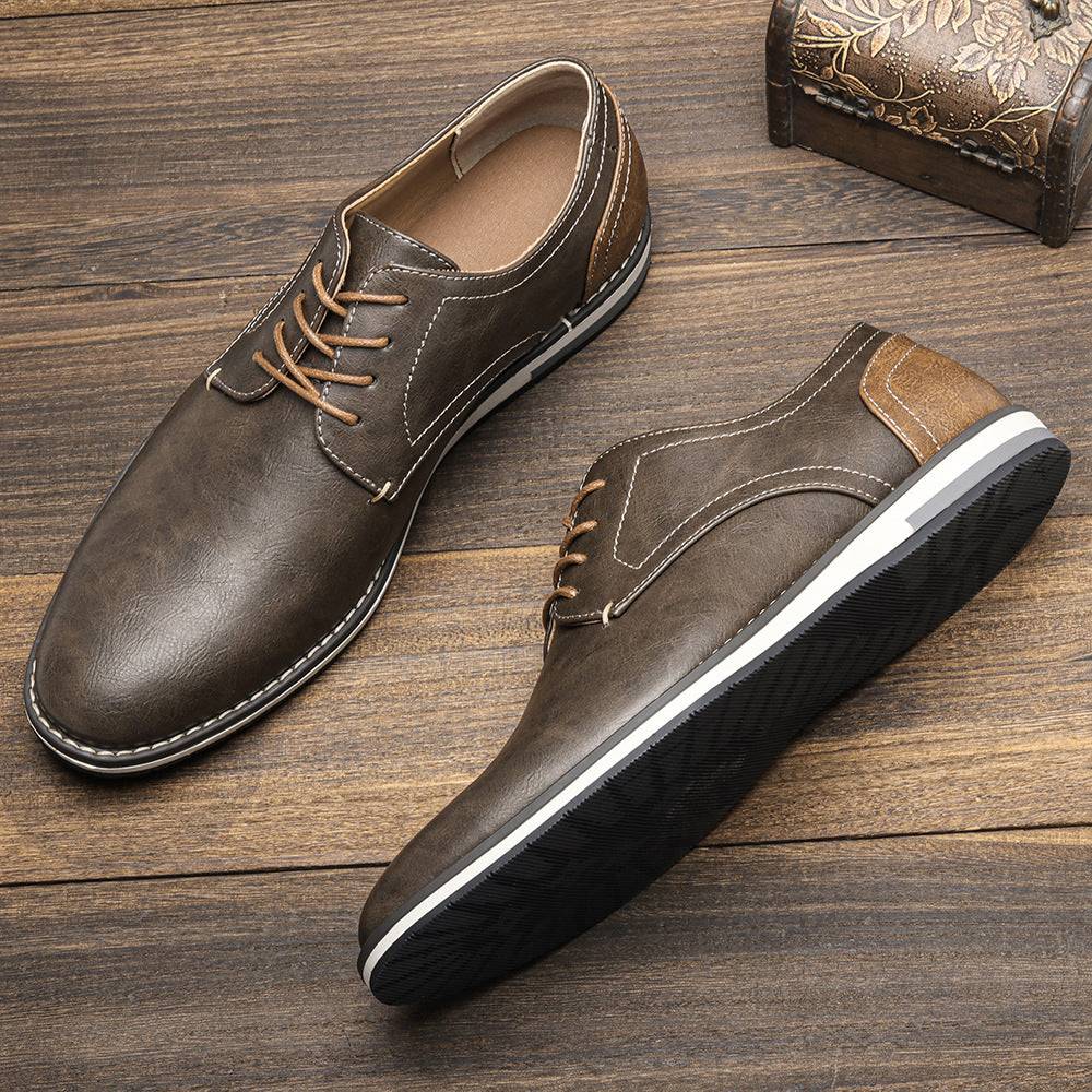 Plus size men’s shoes in brown colorblock design with breathable material and lace-up closure, ideal for casual or semi-formal wear.