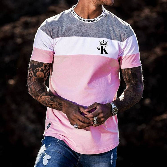 Casual round neck t-shirt with digital printing in pink, white, and gray color block design, short sleeves, and logo on chest.
