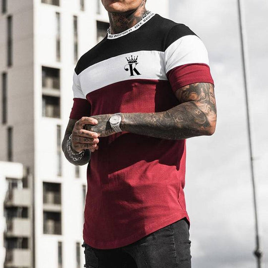 Color block casual round neck t-shirt in red, white, and black with short sleeves and digital printed chest logo for streetwear style.