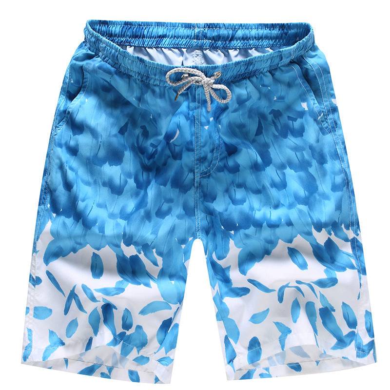 Light blue men's beach shorts with abstract leaf pattern, offering a fresh and breezy style for summer activities.