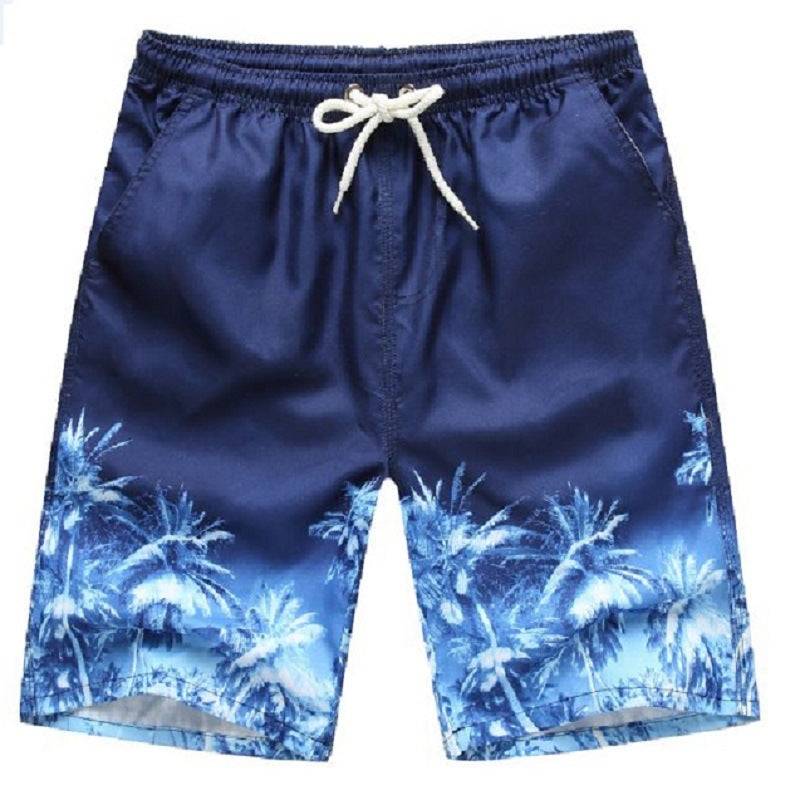 Blue men's beach shorts with tropical palm tree print, perfect for a relaxed and stylish beach day.