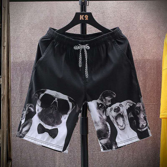 Black men's beach shorts featuring playful dog prints in grayscale, ideal for casual and stylish beach outings.
