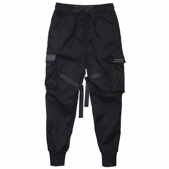 Flat-lay of black men's cargo jogger pants featuring adjustable ribbons, elastic cuffs, and utility pockets for versatile wear.