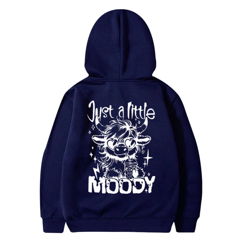Navy blue hoodie for men and women featuring white 'Just a Little Moody' cartoon cow print, stylish for leisurewear fashion.