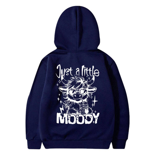 Navy blue hoodie for men and women featuring white 'Just a Little Moody' cartoon cow print, stylish for leisurewear fashion.