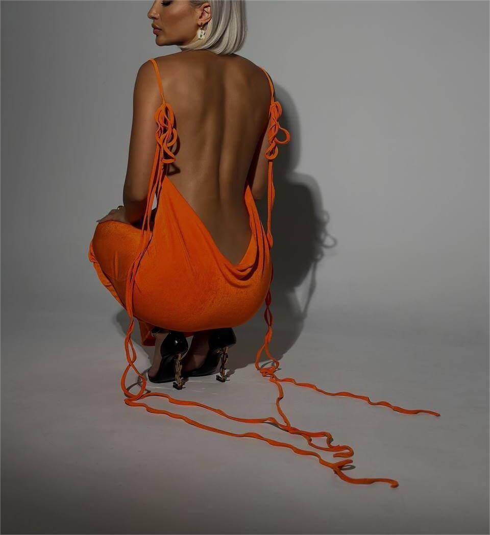 Sexy Slim Backless Lace-up Dress in vibrant orange, featuring a draped open back and long lace-up straps for a bold summer look.