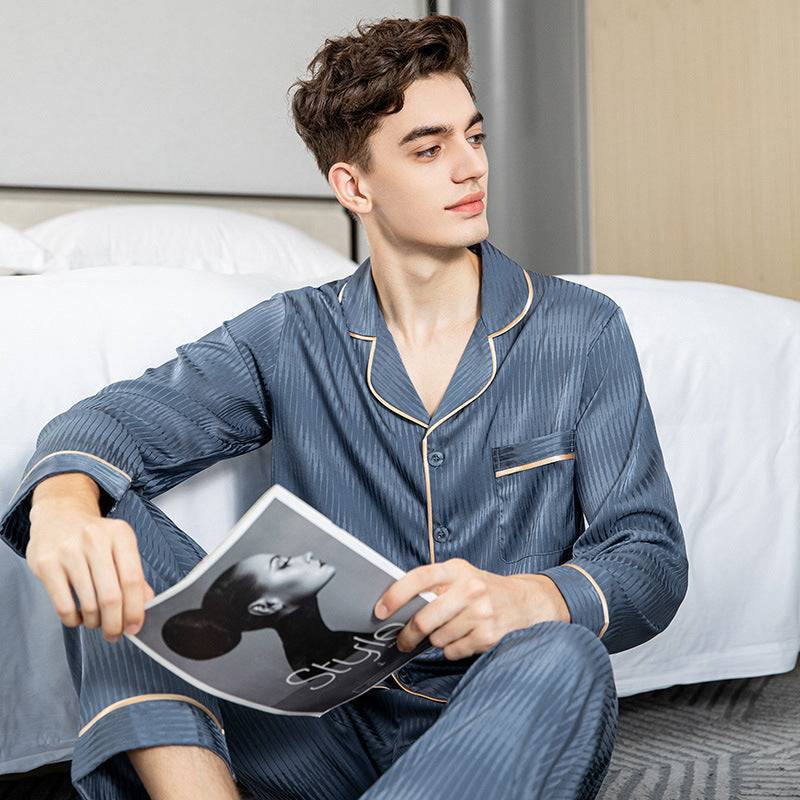 Blue men's silk pajamas made from breathable ice silk, designed with a V-neck and piping details, perfect for relaxed leisure wear.