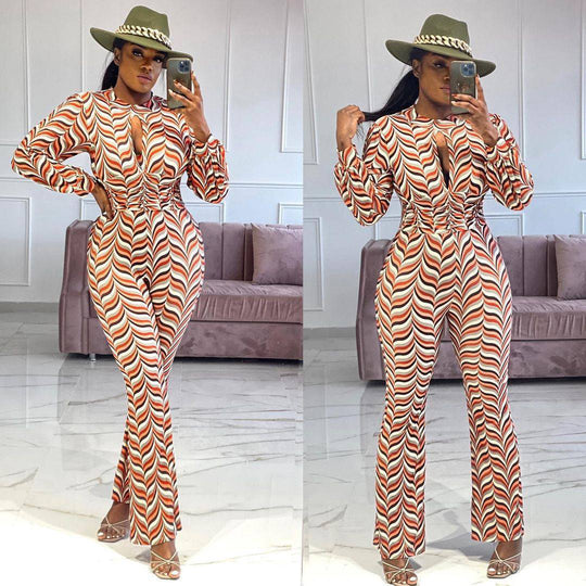 Smocked Print Flared Jumpsuit with cutout nipped waist in red and white chevron pattern, styled with heels and a hat for a chic look.