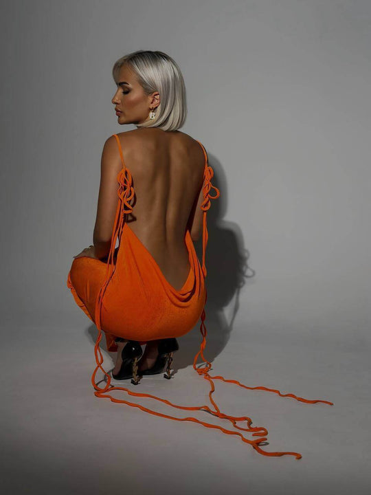 Orange Slim Backless Lace-up Dress with a draped open back and extended lace-up straps, perfect for summer parties or beach nights.