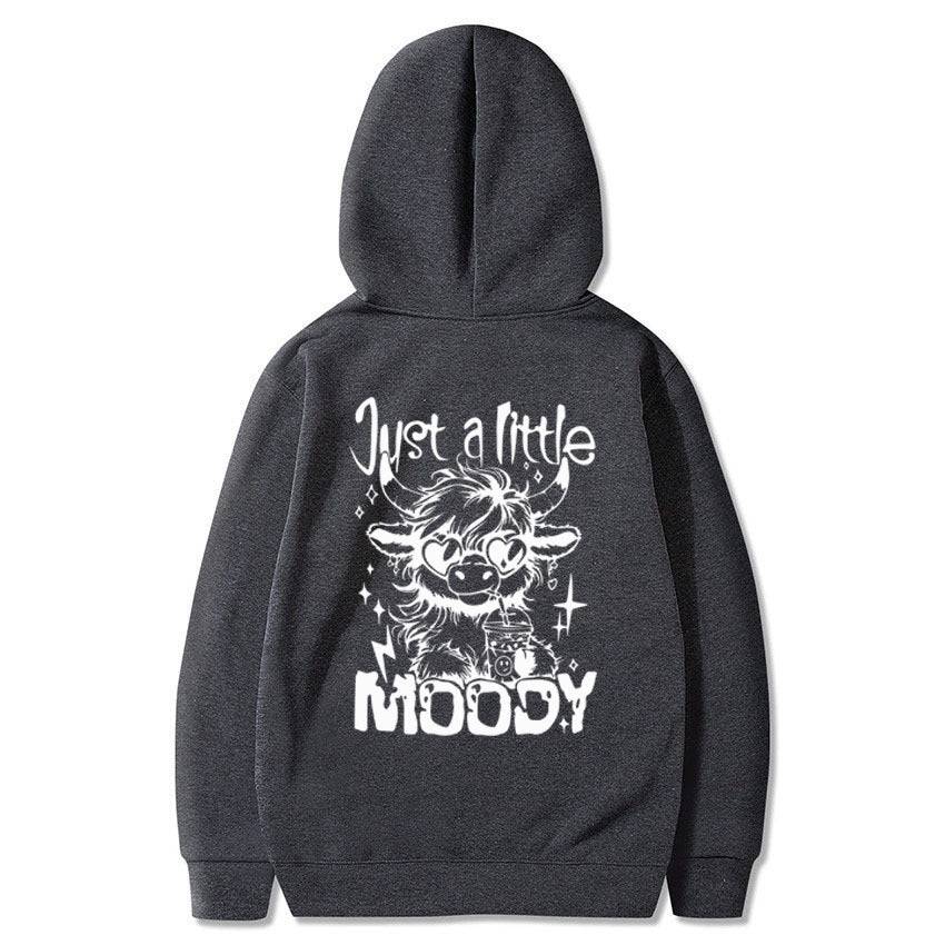 Dark gray American casual hoodie with white 'Just a Little Moody' cartoon cow print, perfect for relaxed fashion looks.