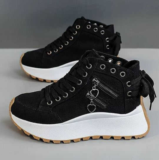 Black women's fashion sneakers with platform sole, dual zipper heart charms, and lace-up high-top design for casual styling.