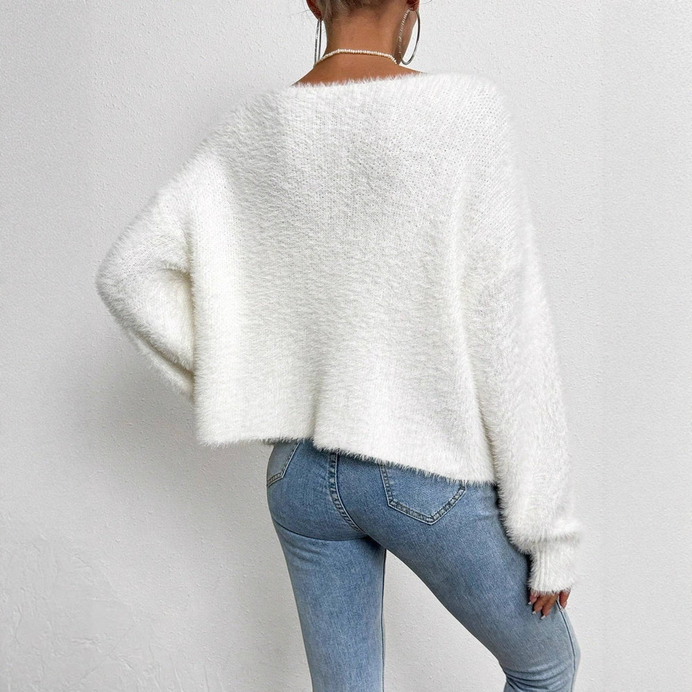 Back view of Women's V-Neck Bead Knitwear Cardigan in soft white polyester, showcasing its relaxed fit and cozy texture.
