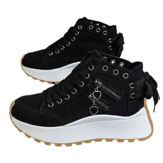 Black high-top women's platform sneakers with thick white sole, zipper accents, and heart-shaped charms, ideal for casual wear.