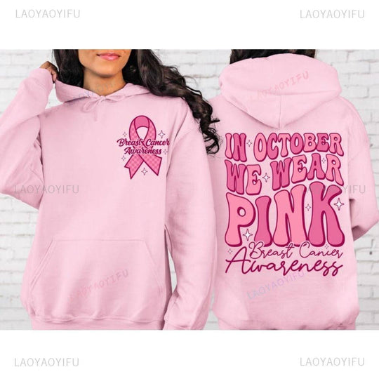 Soft pink hoodie with front breast cancer ribbon and large October awareness slogan on back, retro style polyester streetwear.
