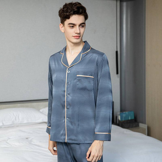 Men's silk pajamas in blue ice silk with a button-up long-sleeved top and matching trousers, offering comfort and luxury for home wear.